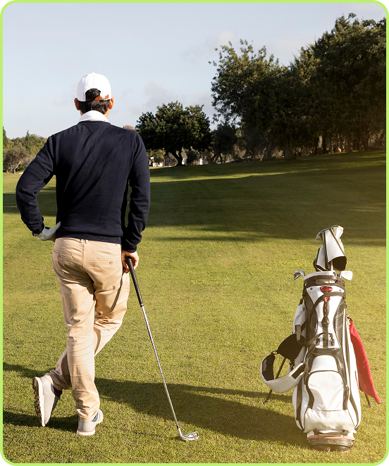 Golfer walking on course