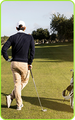 Golfer walking on course